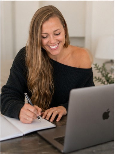 Jess writing in her planner while building a client's plan